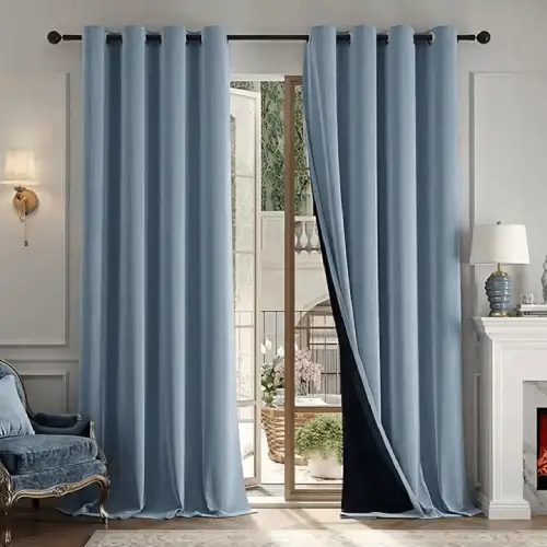 Custom drapery hanging on a modern living room window.