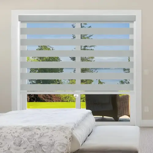 Custom zebra dual blinds mounted inside a modern window frame.